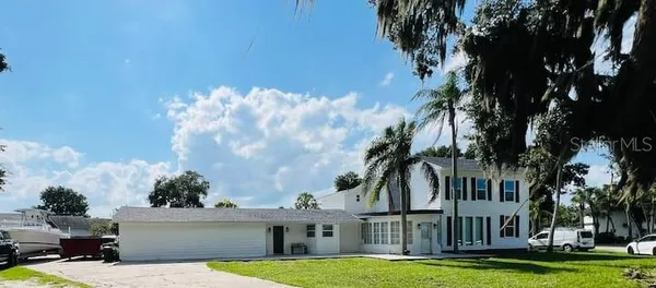 a view of building with yard in front of it