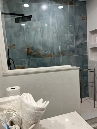 a bathroom with a shower and a toilet