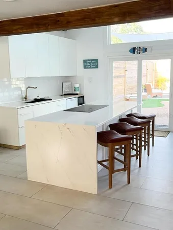 a kitchen with a table and chairs in it