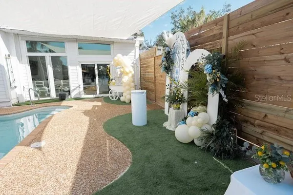 a view of a patio with chairs and tables