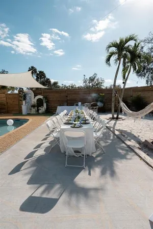 a view of a patio with furniture and a yard