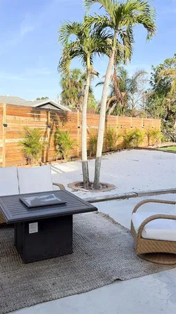 a view of a backyard of the house