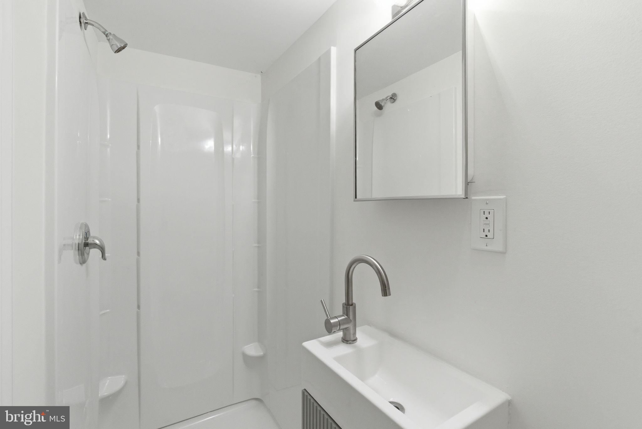 4111 Roland View Avenue Baltimore, MD 21215 - Photo 19 of 19 Sleek, modern bathroom oasis.