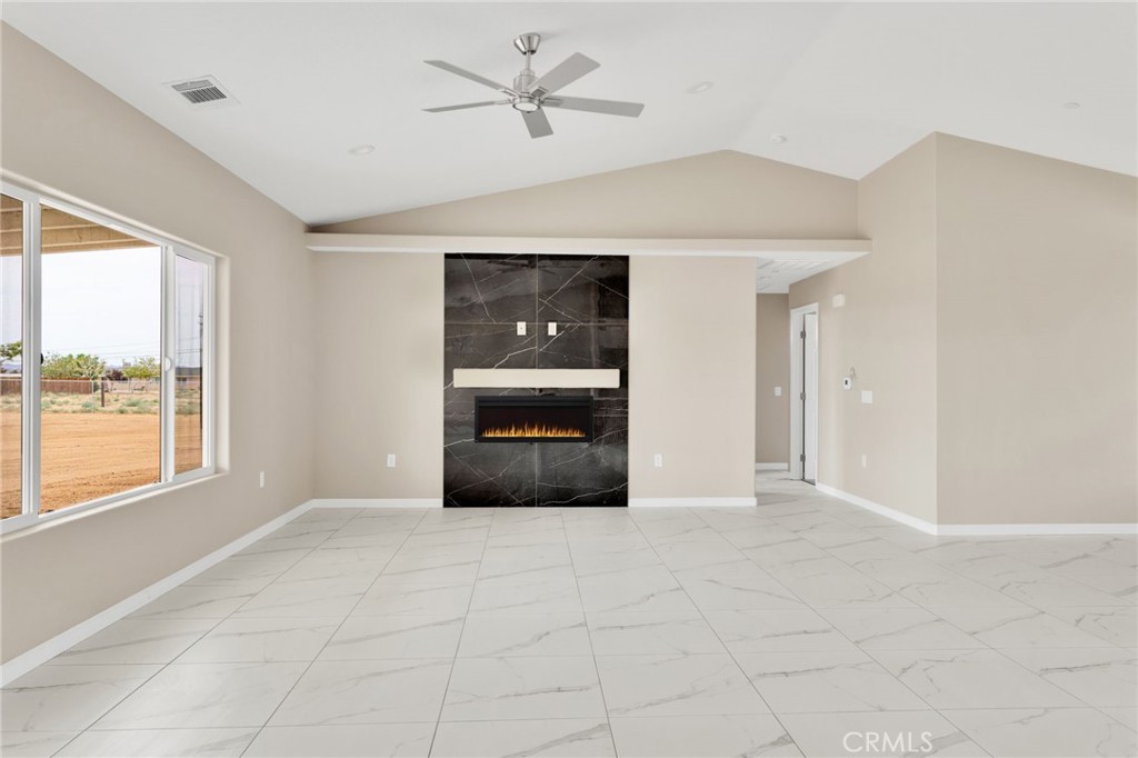 12584 Mesquite Road Apple Valley, CA 92308 - Photo 11 of 44 a view of an empty room with a window