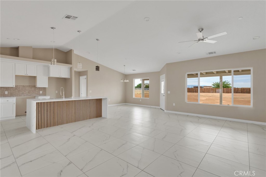 12584 Mesquite Road Apple Valley, CA 92308 - Photo 13 of 44 a view of an empty room with a window