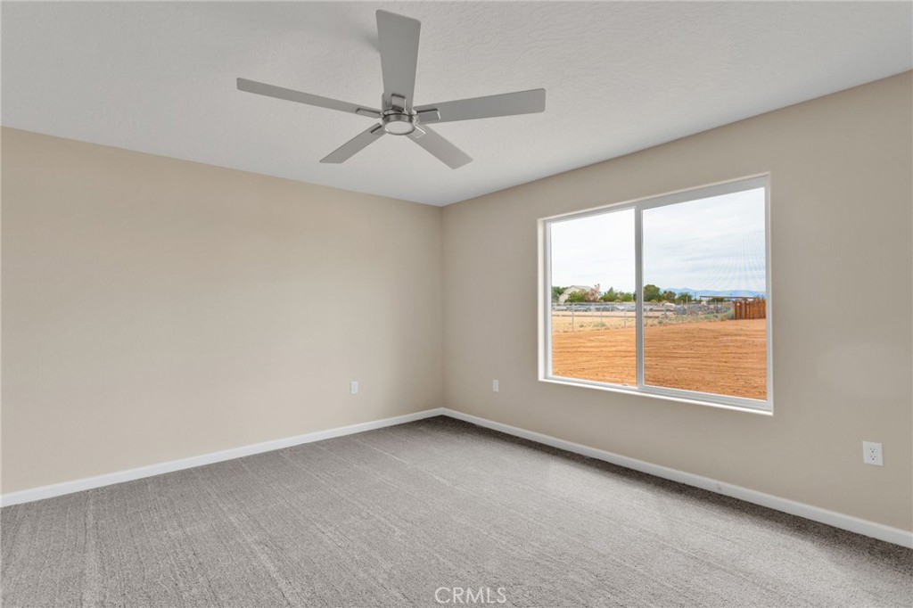 12584 Mesquite Road Apple Valley, CA 92308 - Photo 14 of 44 an empty room with a window