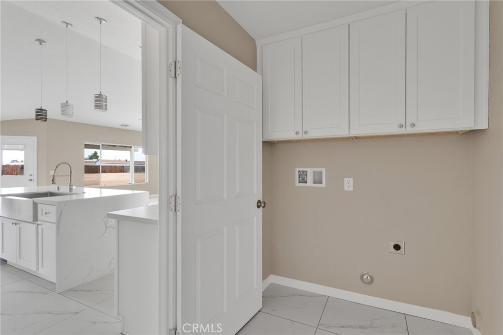 12584 Mesquite Road Apple Valley, CA 92308 - Photo 20 of 44 a kitchen with white cabinets and white appliances