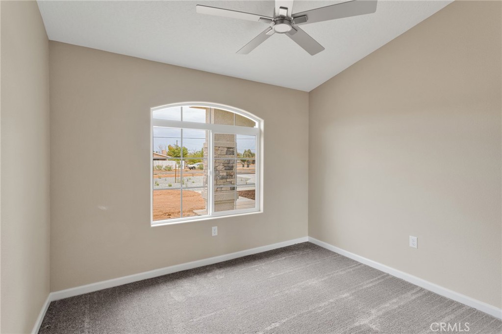 12584 Mesquite Road Apple Valley, CA 92308 - Photo 22 of 44 an empty room with a window