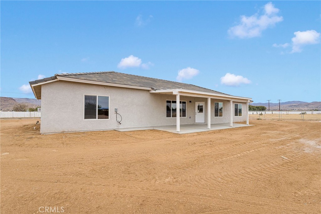 12584 Mesquite Road Apple Valley, CA 92308 - Photo 33 of 44 a view of a house with a swimming pool