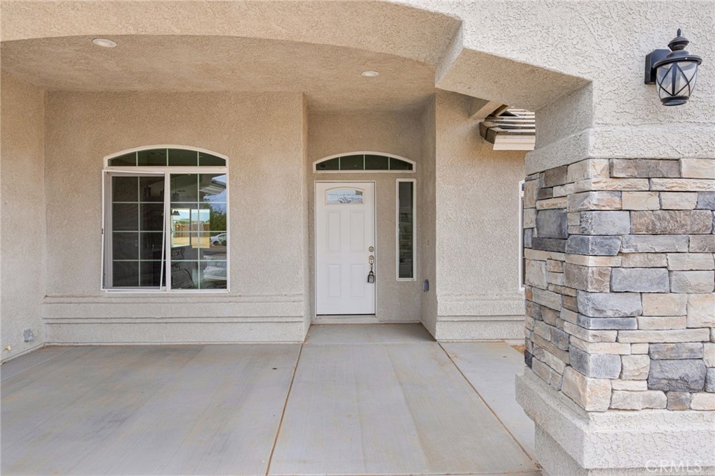 12584 Mesquite Road Apple Valley, CA 92308 - Photo 4 of 44 a view of front door of house