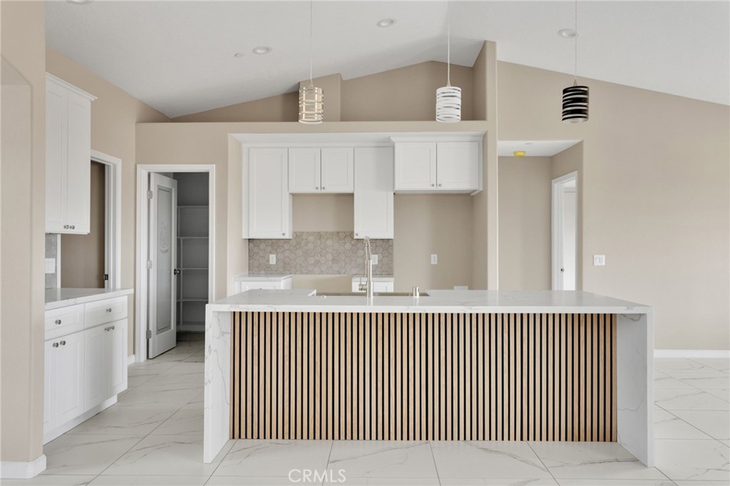 12584 Mesquite Road Apple Valley, CA 92308 - Photo 8 of 44 a view of a kitchen from the hallway