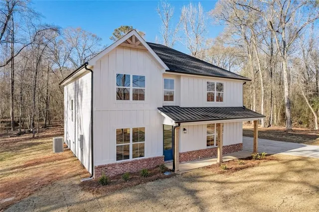 a front view of a house with a garage