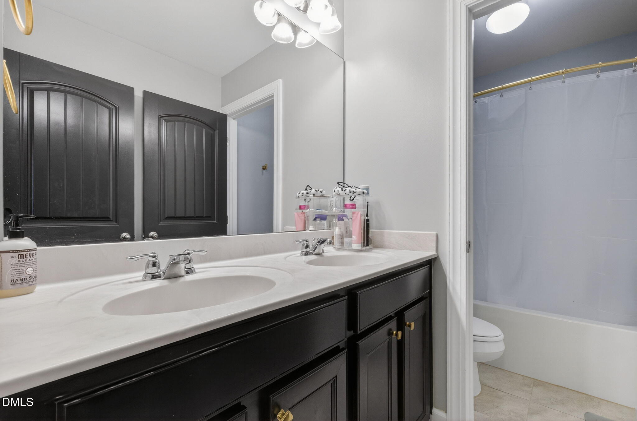 801 Tree Green Lane Wake Forest, NC 27587 - Photo 16 of 28 a bathroom with a granite countertop sink a toilet and a large mirror