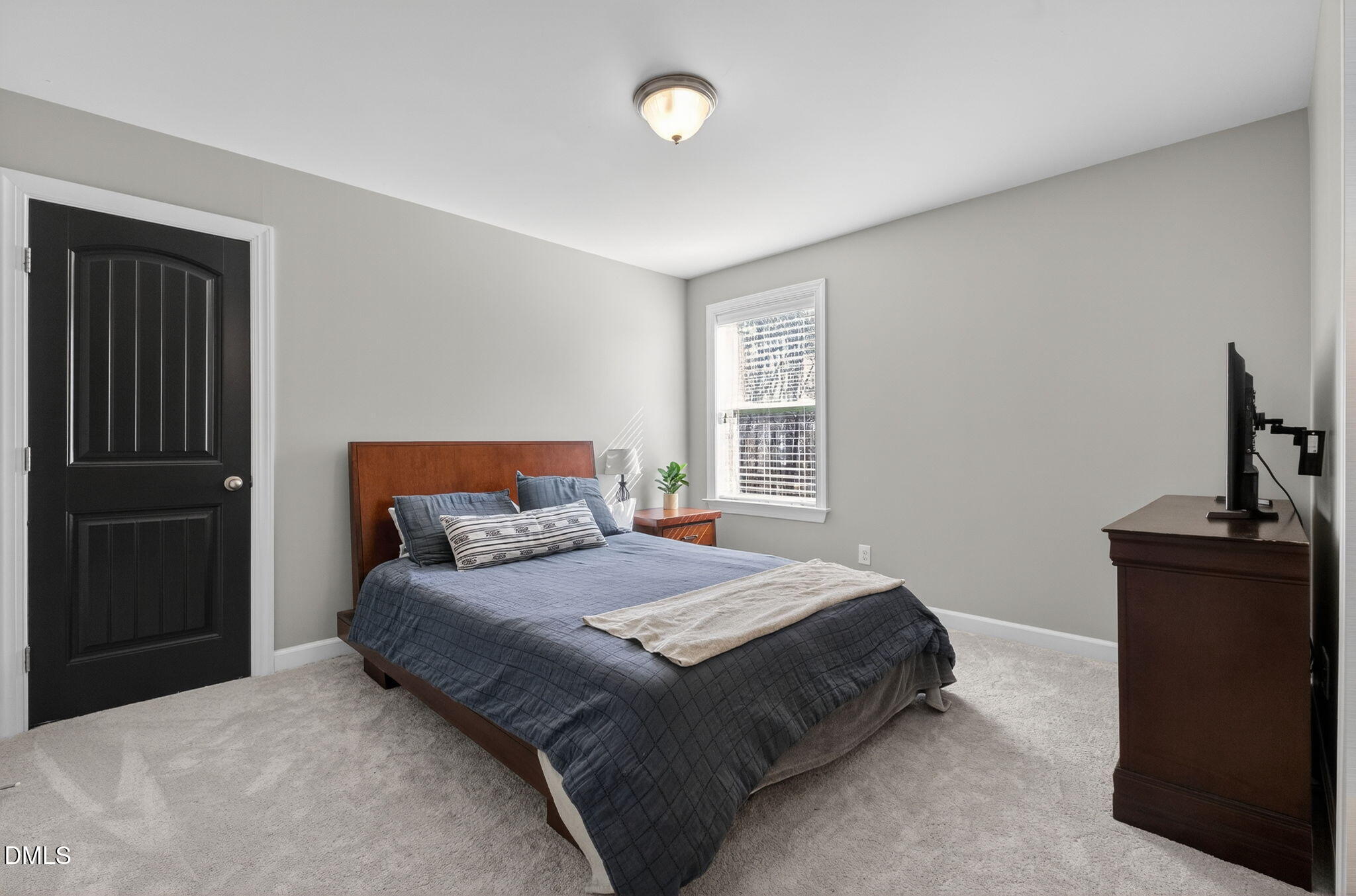 801 Tree Green Lane Wake Forest, NC 27587 - Photo 17 of 28 a bedroom with a bed and a window