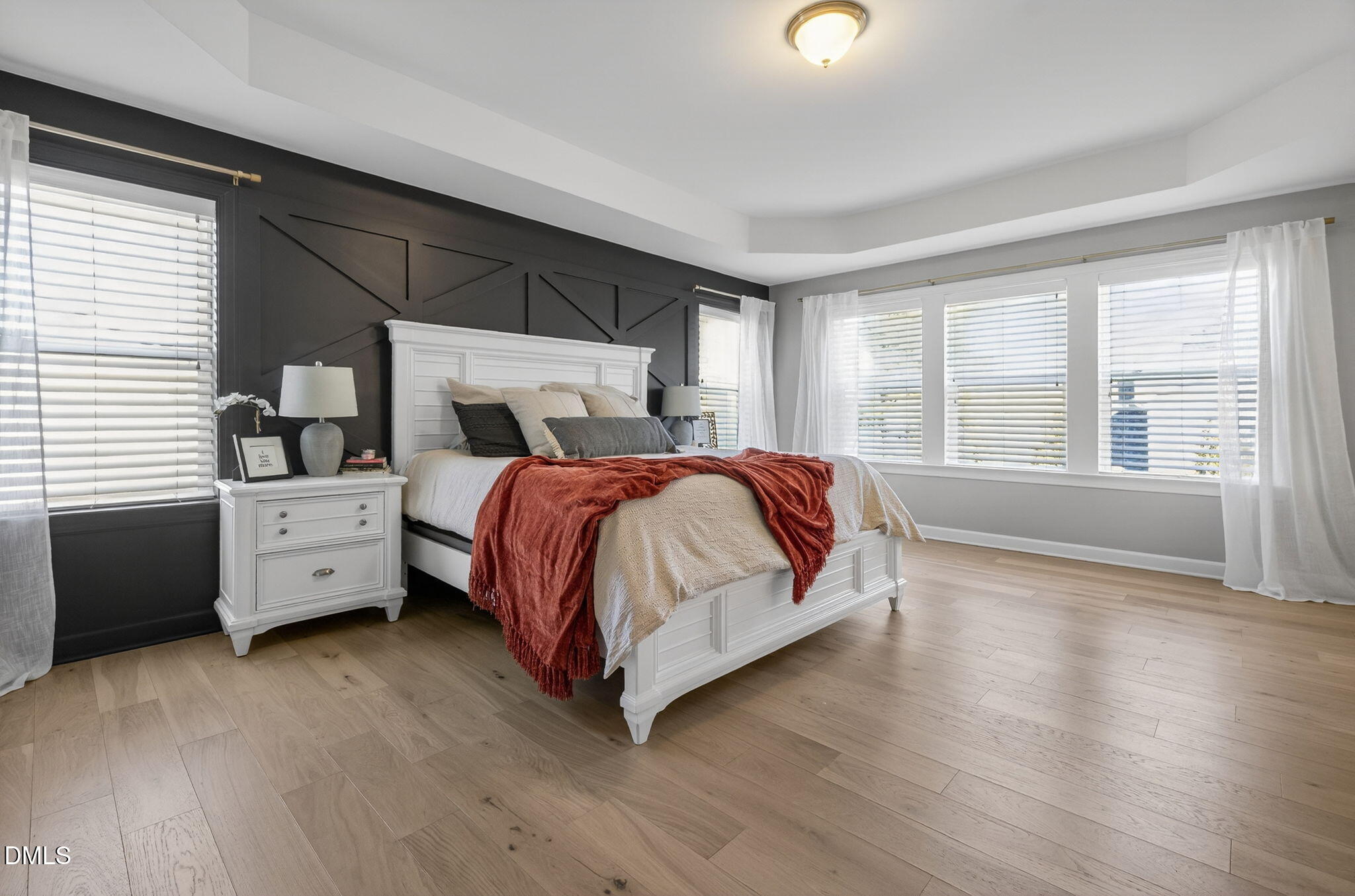 801 Tree Green Lane Wake Forest, NC 27587 - Photo 19 of 28 a spacious bedroom with a large bed and a large window