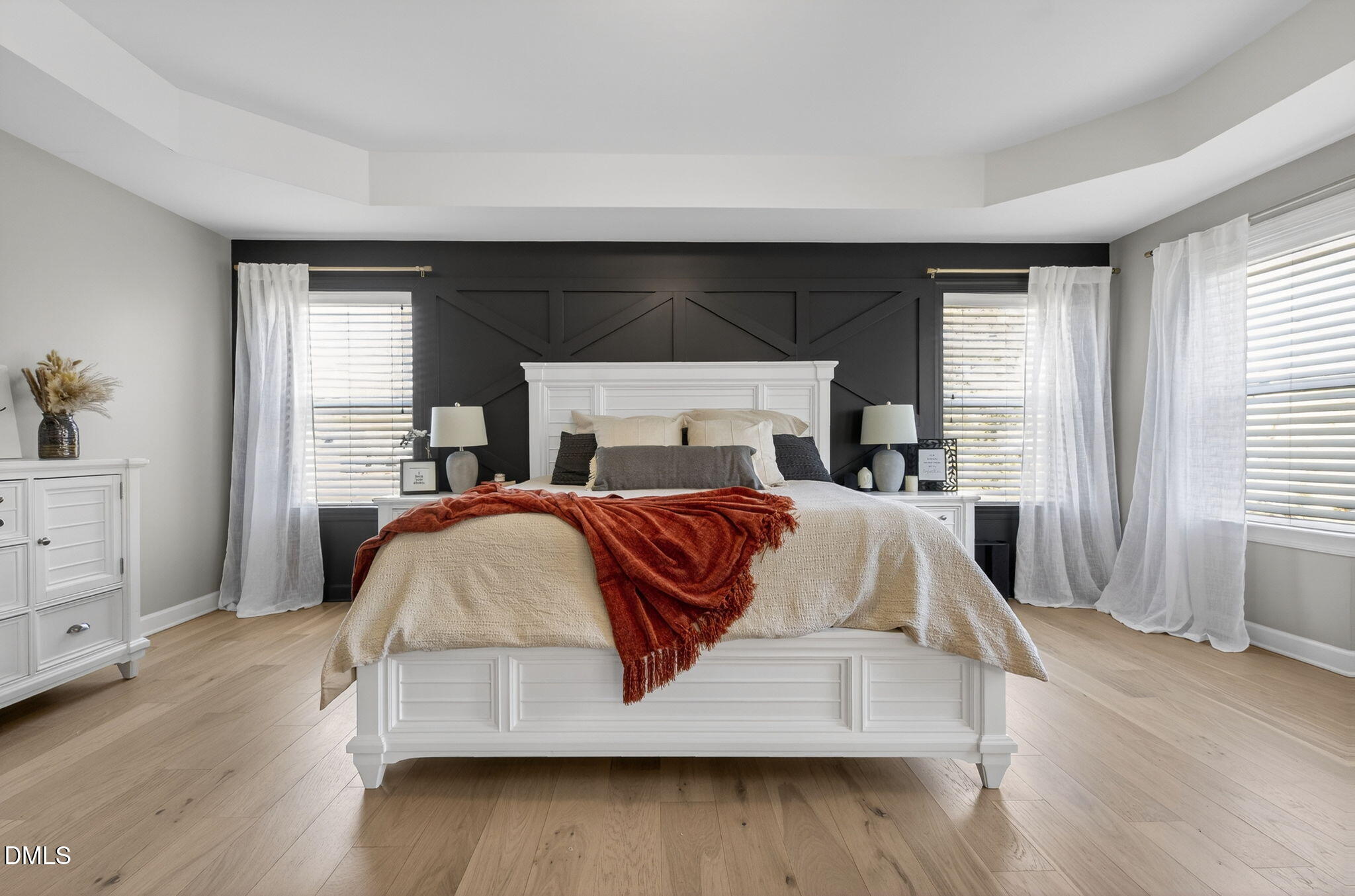 801 Tree Green Lane Wake Forest, NC 27587 - Photo 20 of 28 a bedroom with a large bed and wooden floor