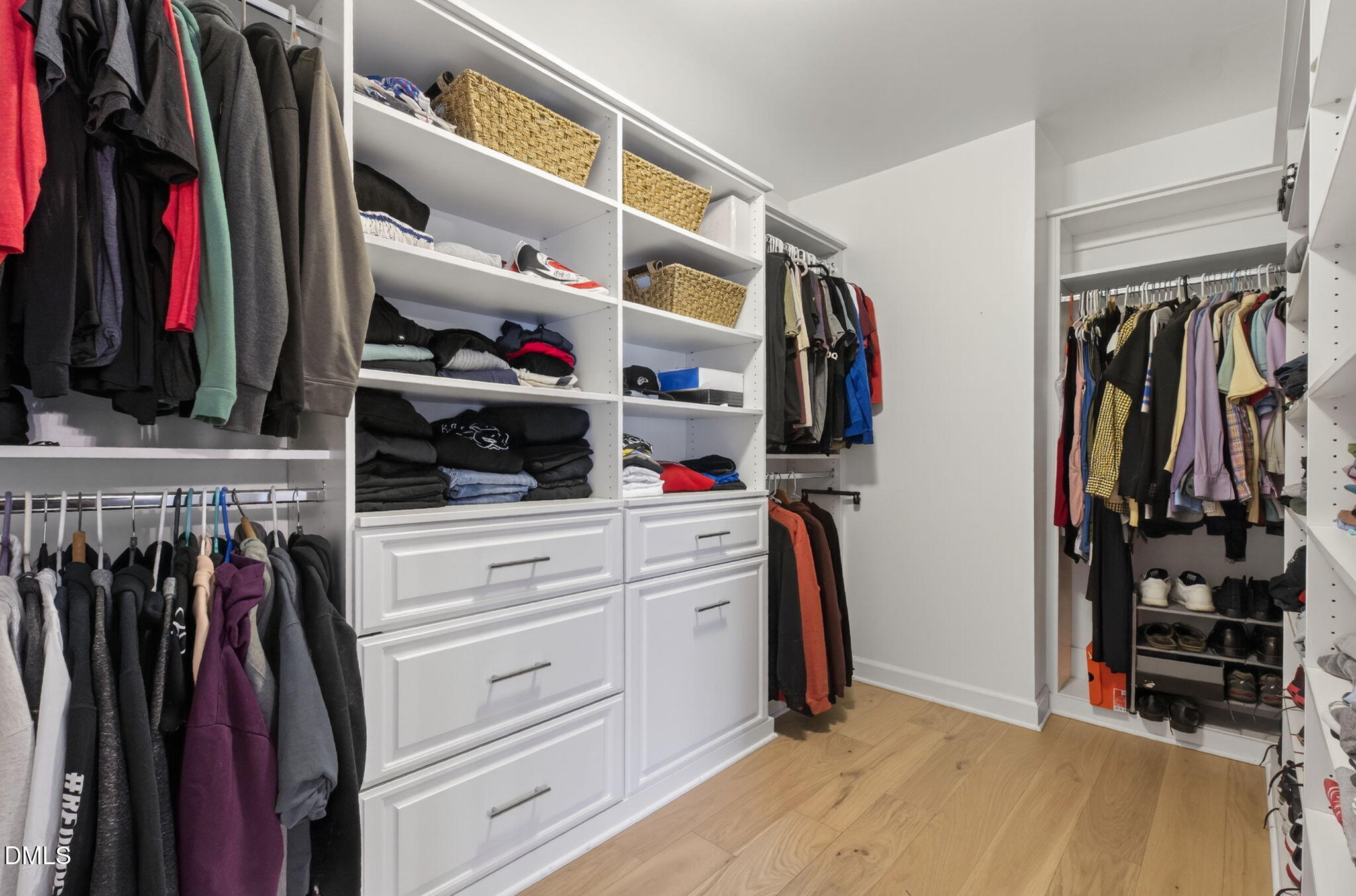 801 Tree Green Lane Wake Forest, NC 27587 - Photo 24 of 28 a view of walk in closet with clothes and shoes