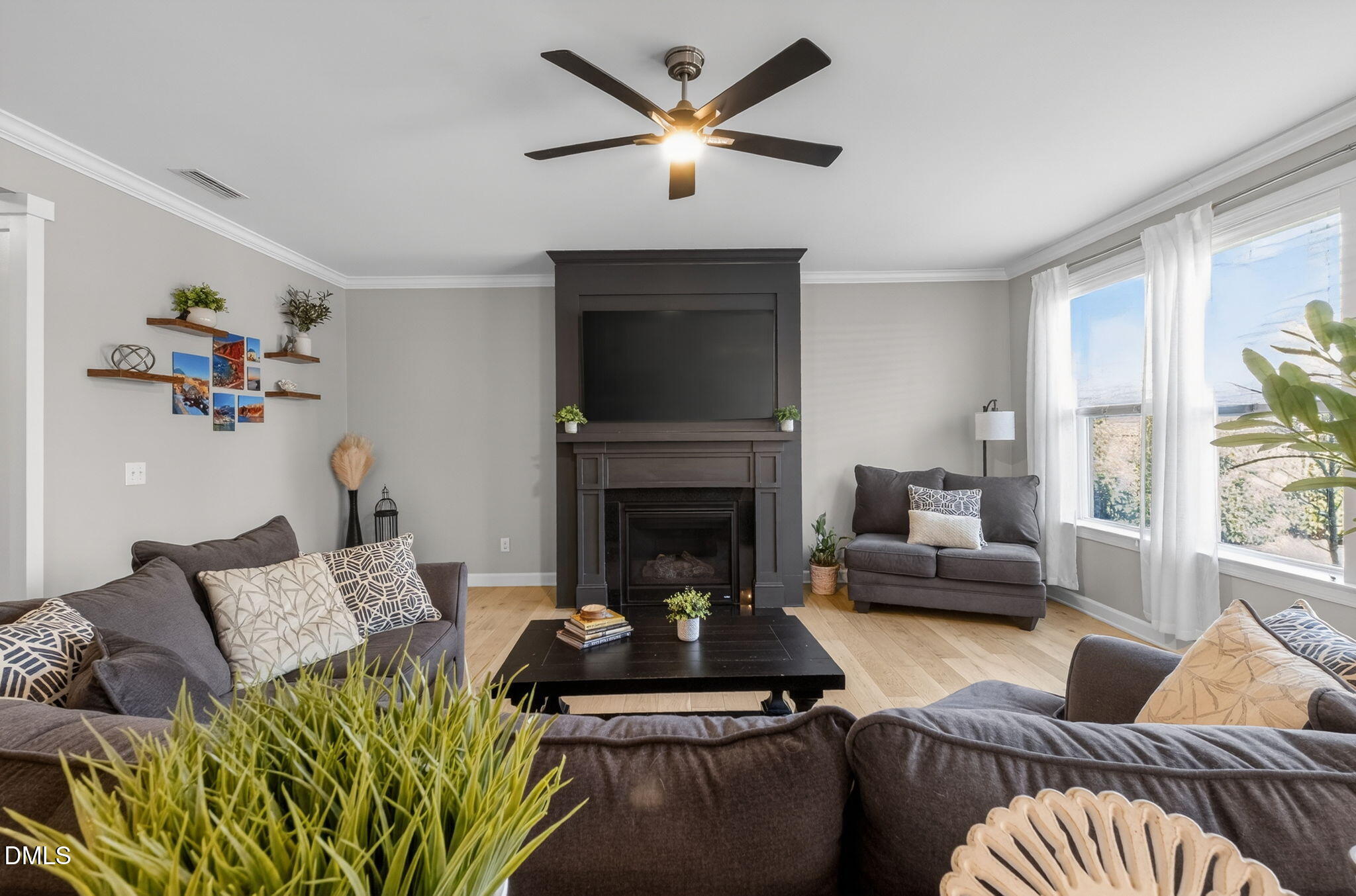 801 Tree Green Lane Wake Forest, NC 27587 - Photo 6 of 28 a living room with furniture and a fireplace