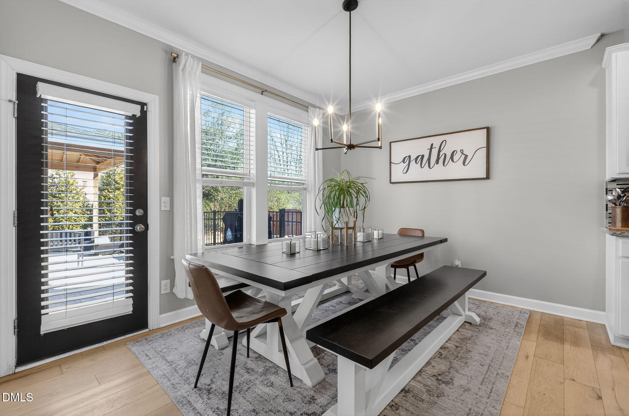 801 Tree Green Lane Wake Forest, NC 27587 - Photo 7 of 28 a view of a dining room with furniture window and wooden floor