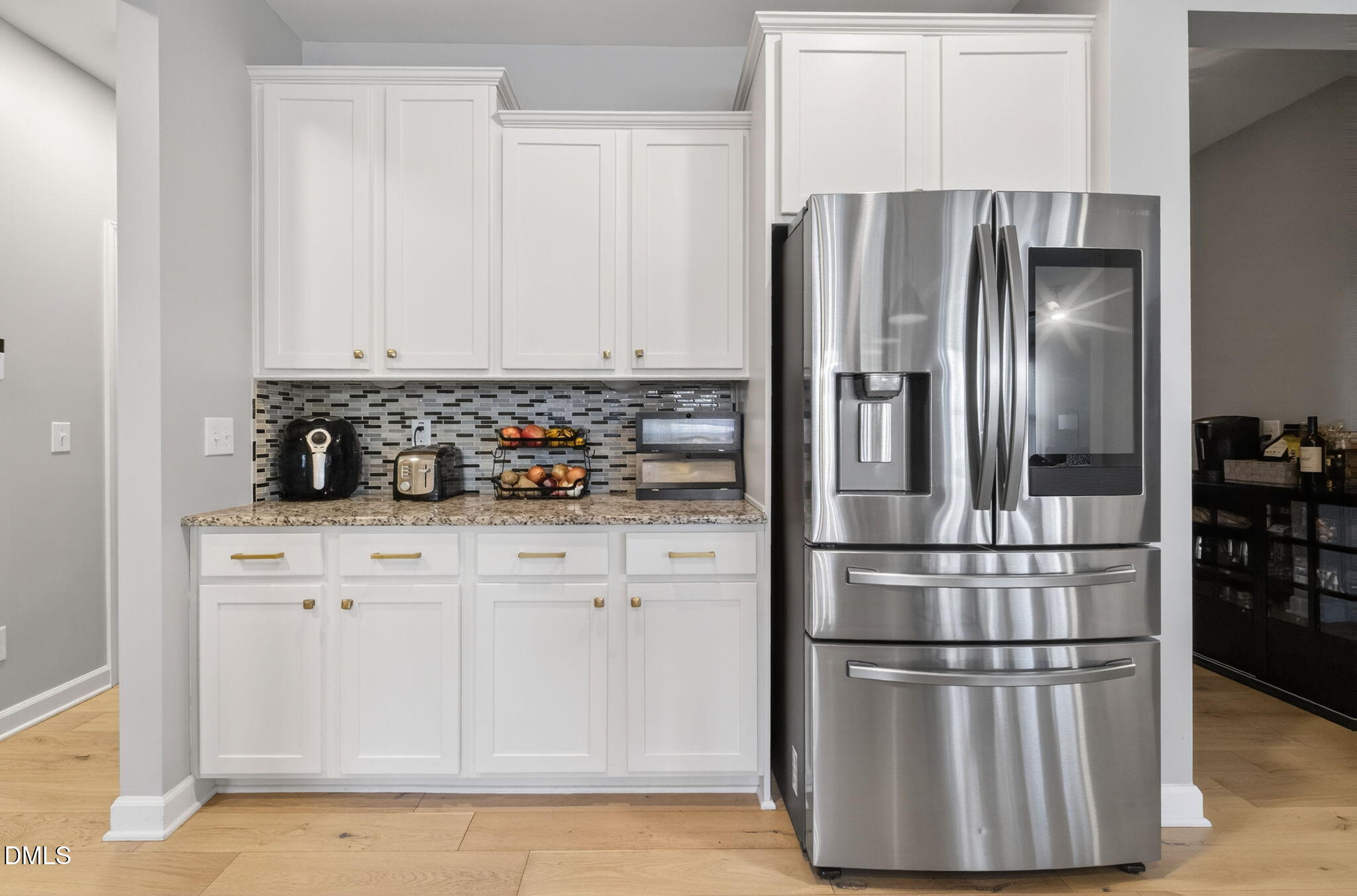 801 Tree Green Lane Wake Forest, NC 27587 - Photo 10 of 28 a kitchen with cabinets and stainless steel appliances