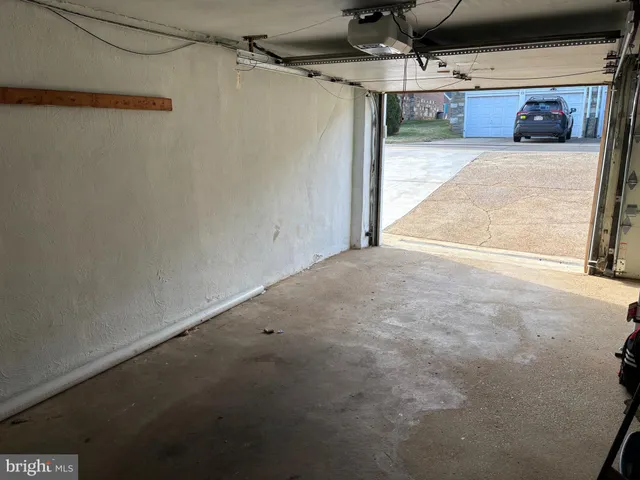 a front view of a building with a garage