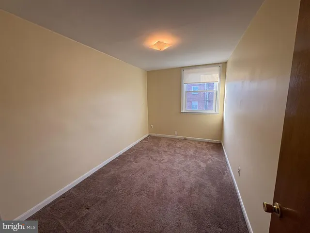 a bathroom with a toilet a sink and a mirror