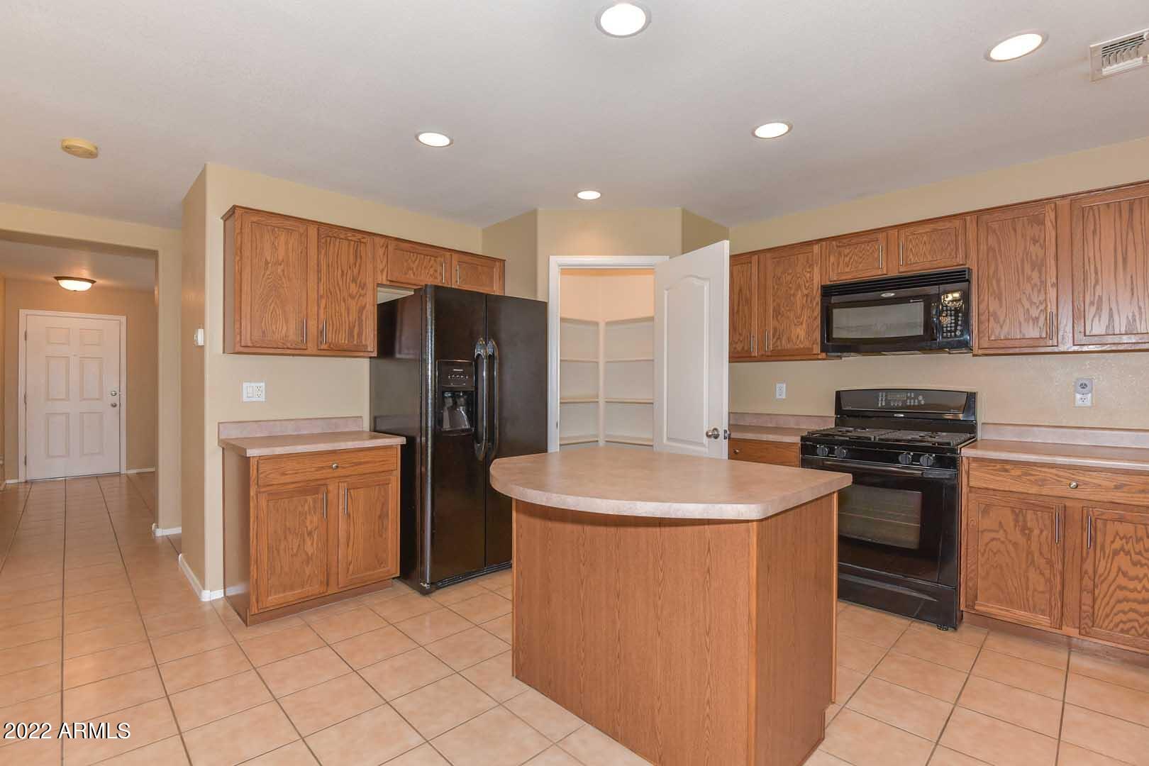 17682 West Red Bird Road Surprise, AZ 85387 - Photo 7 of 42 Kitchen-Pantry
