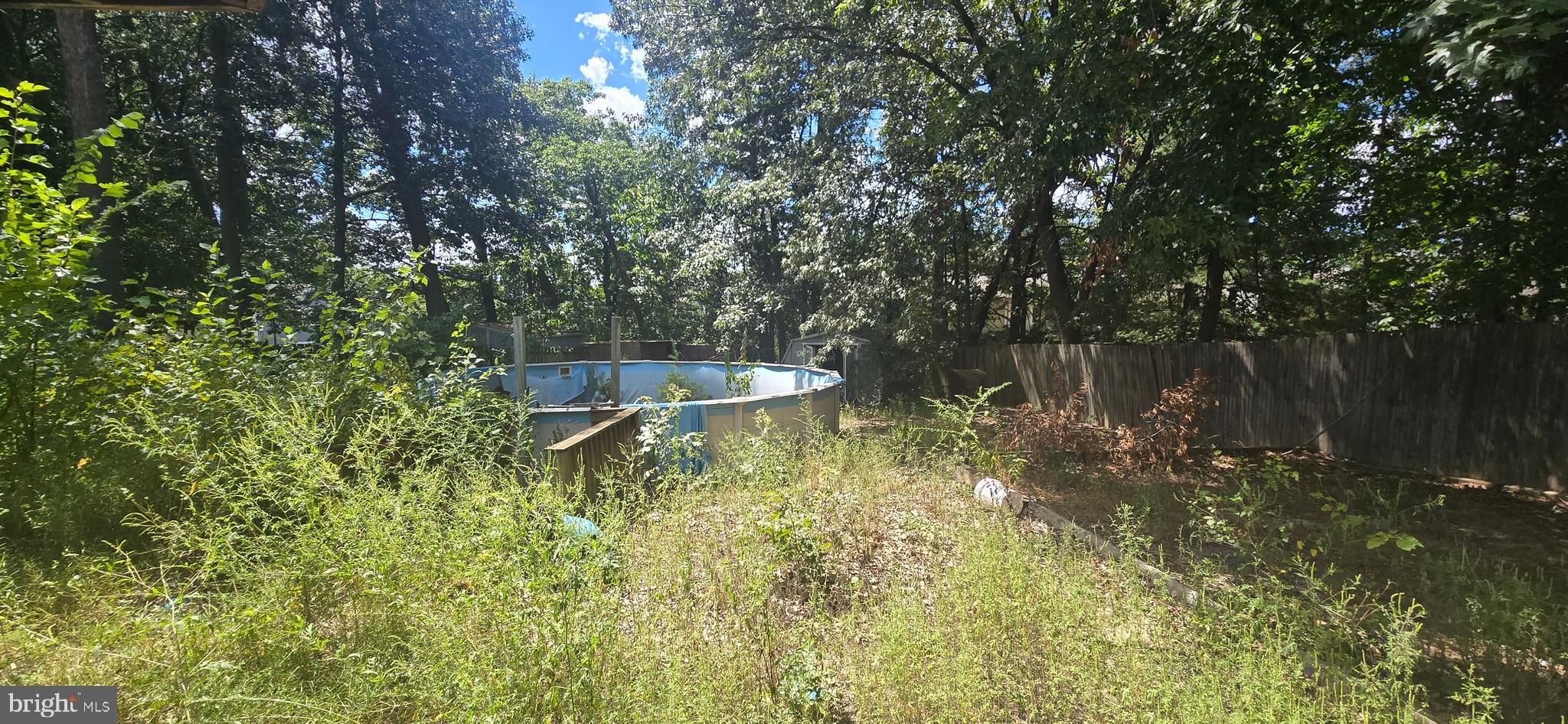9508 Mellow Court Laurel, MD 20723 - Photo 21 of 23 a backyard of a house with lots of green space and fountain