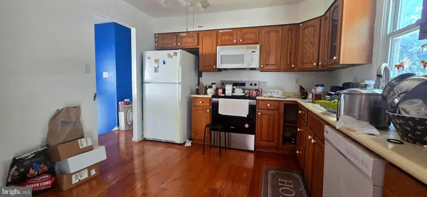 a kitchen with stainless steel appliances granite countertop a refrigerator sink and cabinets