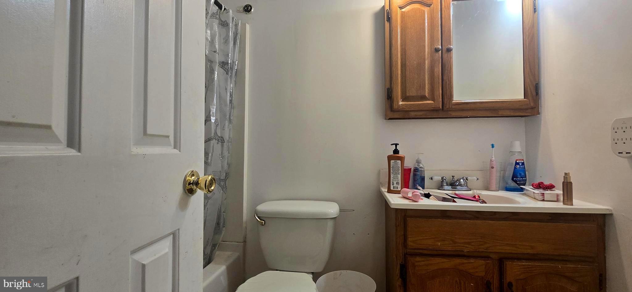9508 Mellow Court Laurel, MD 20723 - Photo 7 of 23 a bathroom with a sink mirror and toilet