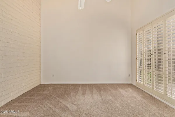 a bathroom with a tub a sink and a large mirror