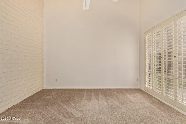 a bathroom with a tub a sink and a large mirror