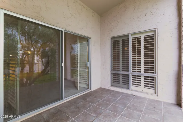 a view of a balcony with a tree
