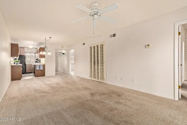 a view of a kitchen with a sink and a refrigerator