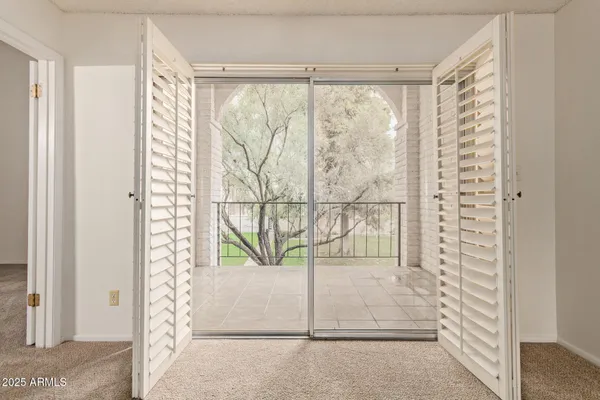 a bathroom with a glass door shower and vanity