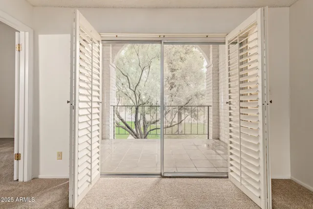 a bathroom with a glass door shower and vanity