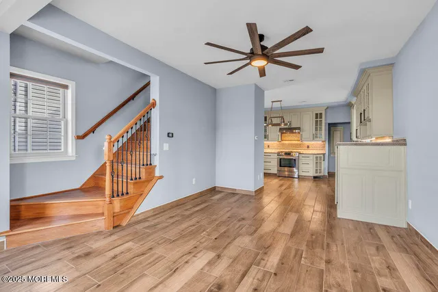 a bathroom with a bathtub and a window