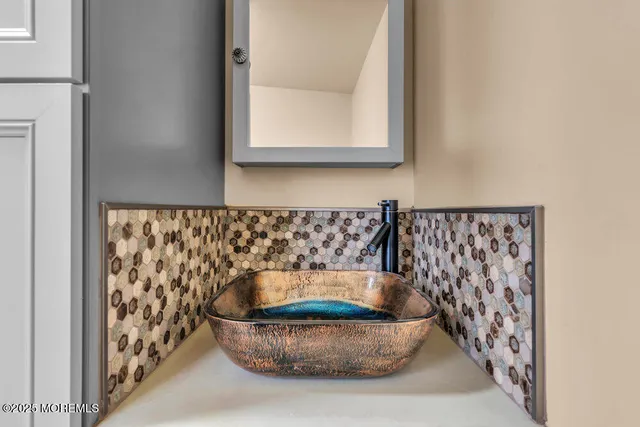 an empty room with fan and entrance