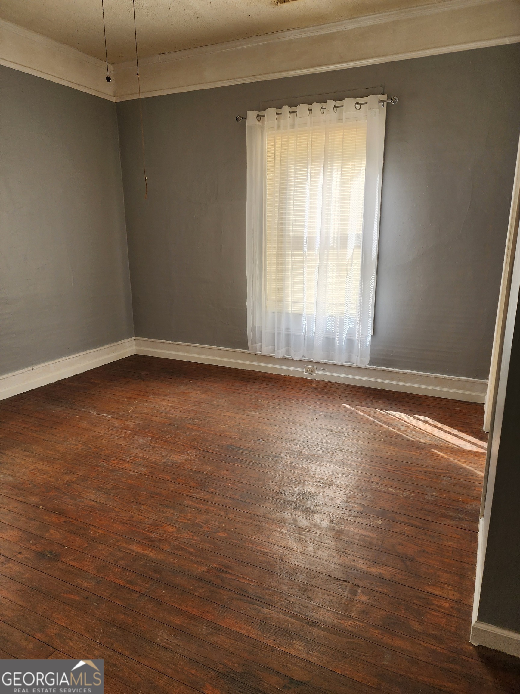 200 Cave Spring Road Southwest Rome, GA 30161 - Photo 11 of 16 wooden floor in an empty room with a window