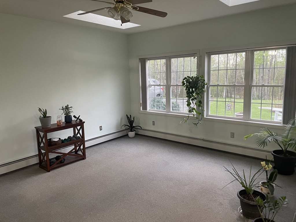290 Woods Road Barre, MA 01005 - Photo 3 of 13 a view of a room with lounge chair and windows
