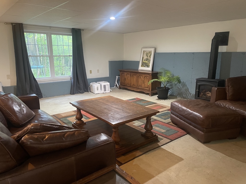 290 Woods Road Barre, MA 01005 - Photo 5 of 13 a living room with furniture and a floor to ceiling window