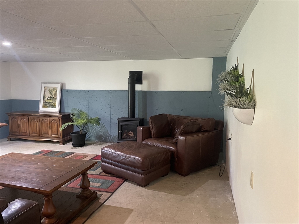 290 Woods Road Barre, MA 01005 - Photo 6 of 13 a living room with furniture and a flat screen tv