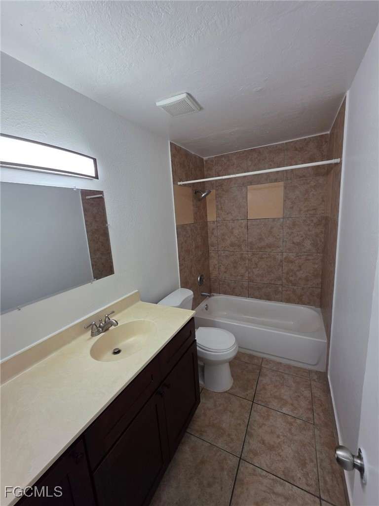 2148 Dora Street, Unit 11 Fort Myers, FL 33901 - Photo 4 of 10 a bathroom with a sink a toilet and shower