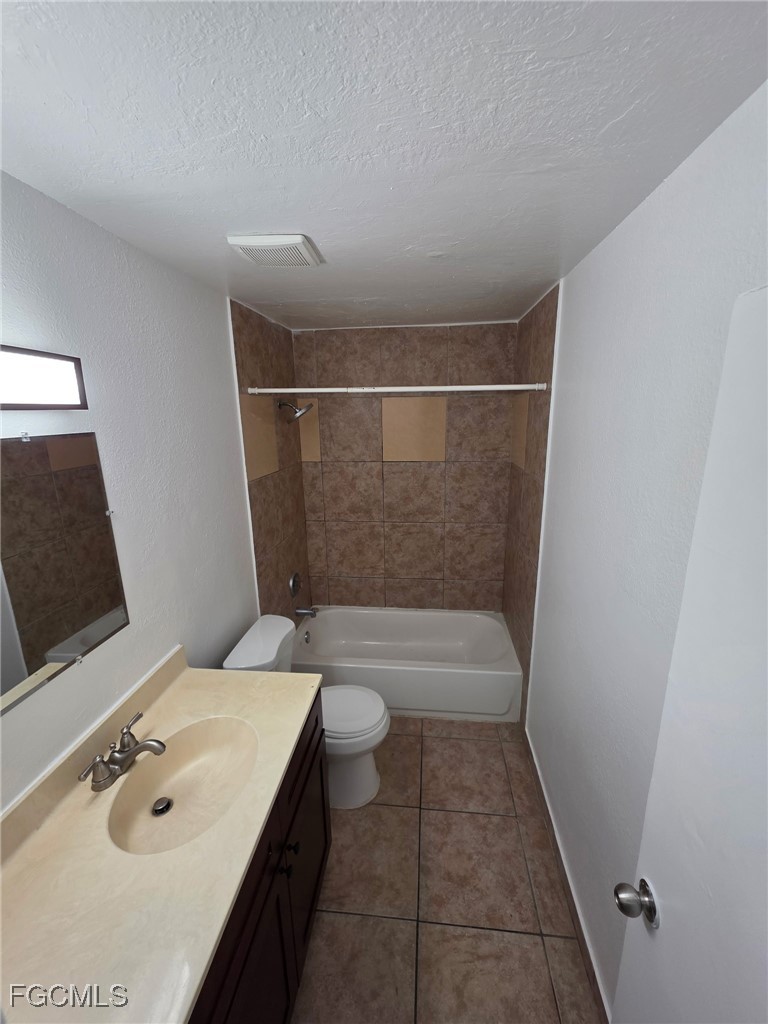 2148 Dora Street, Unit 11 Fort Myers, FL 33901 - Photo 7 of 10 a bathroom with a tub sink and mirror
