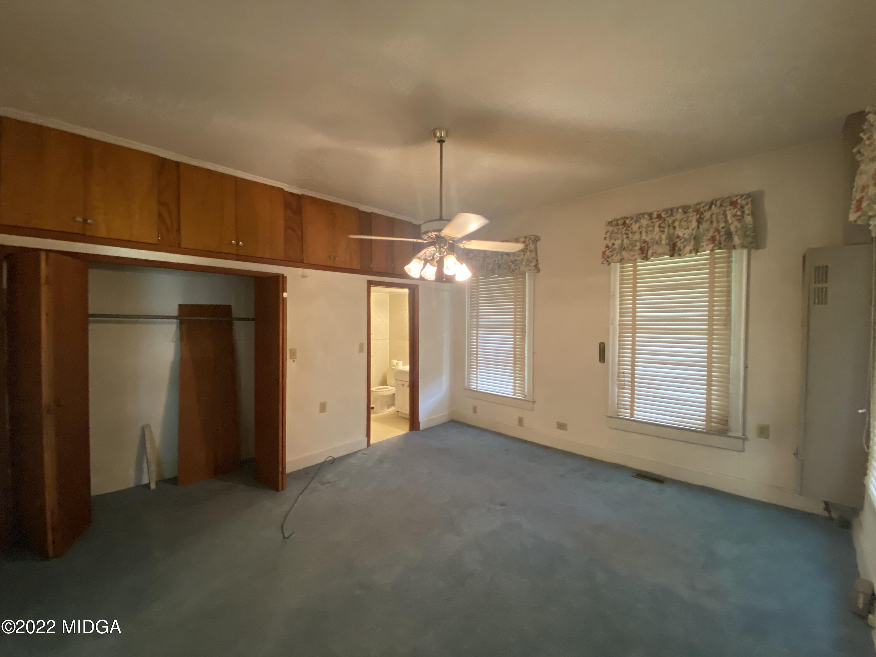 2949 South Lizella Road Lizella, GA 31052 - Photo 5 of 10 a view of a room with a ceiling fan and a window