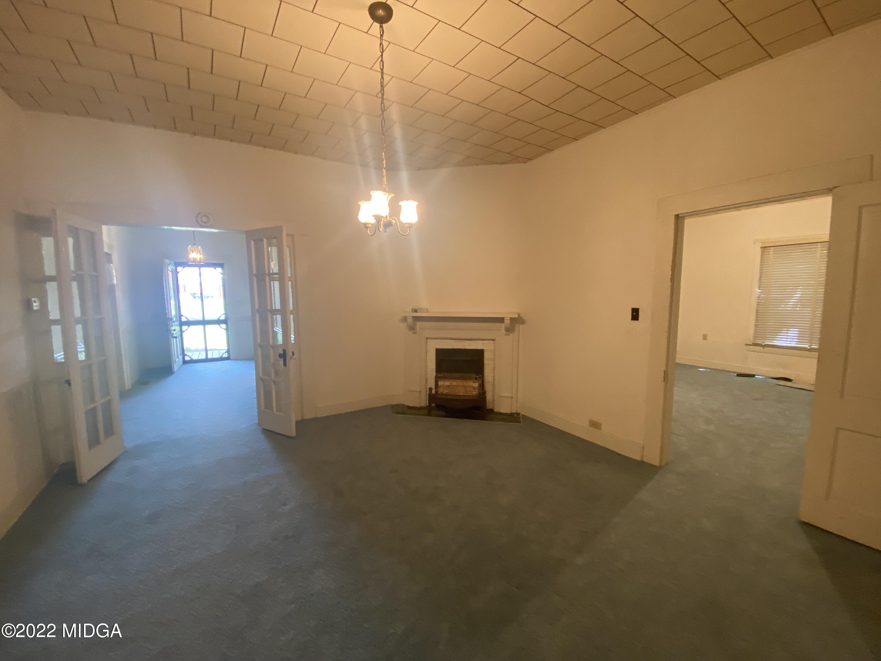 2949 South Lizella Road Lizella, GA 31052 - Photo 8 of 10 an empty room with fan and entrance