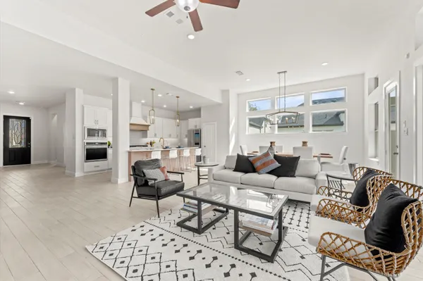 a living room with furniture or outdoor view and a chandelier
