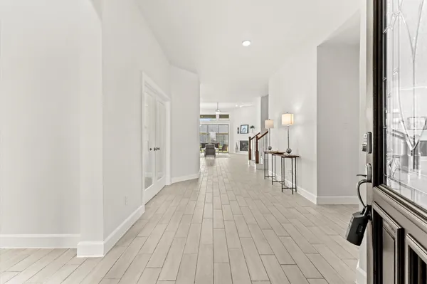 a view of a living room with wooden floor