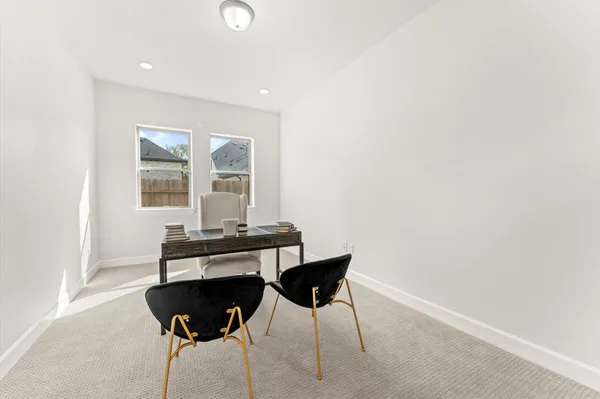 a view of a workspace with furniture