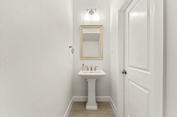 a bathroom with a sink and mirror